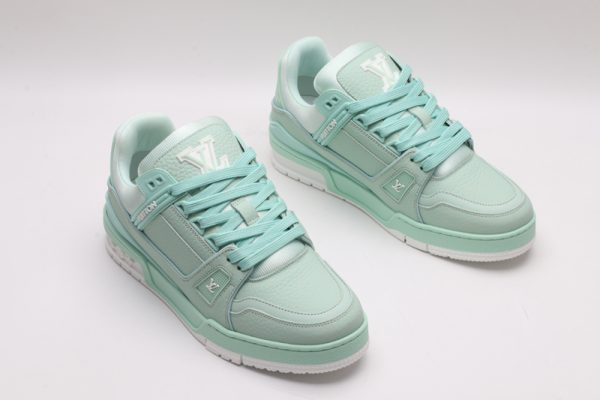 A pair of mint green Louis Vuitton LV Trainer Low-Top Sneakers